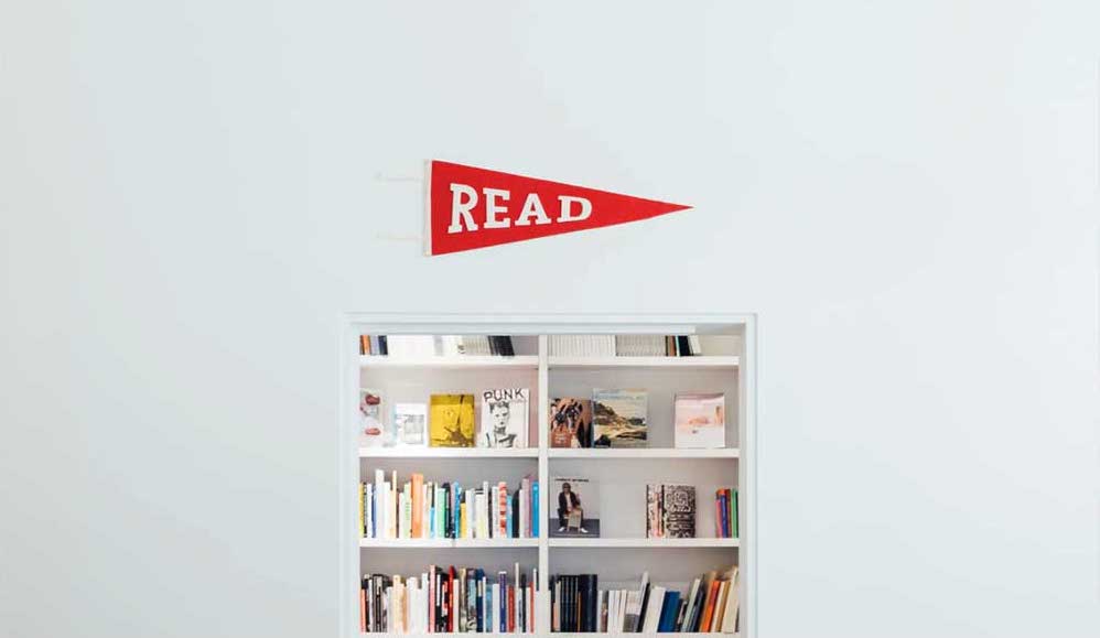 A bookshelf with read written over it